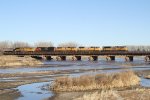 UP 8716 leads a lengthy manifest east over the Platte River on the Marysville Subdivision